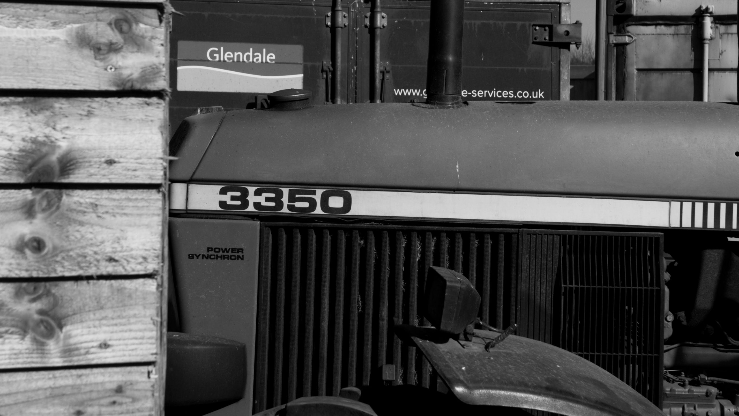 John Deere 3350 tractor in agricultural field, representing Agriware Gunkworks agritech research and development for predictive maintenance in farming machinery.