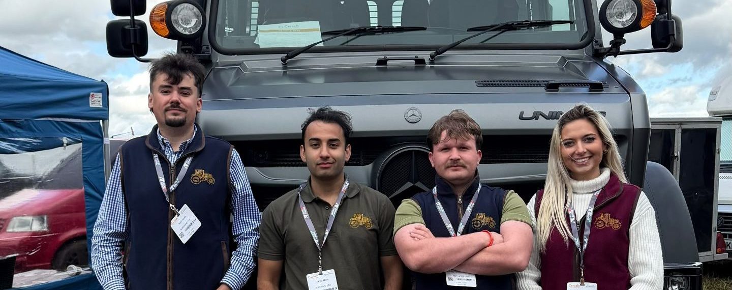 Agriware UK team attending Cereals 2026 event at Diddly Squat Farm. Standing infront of a Mercedes Unimog at the Ibbetts Unimog stand.